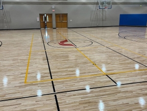 hardwood floor installation at a gym