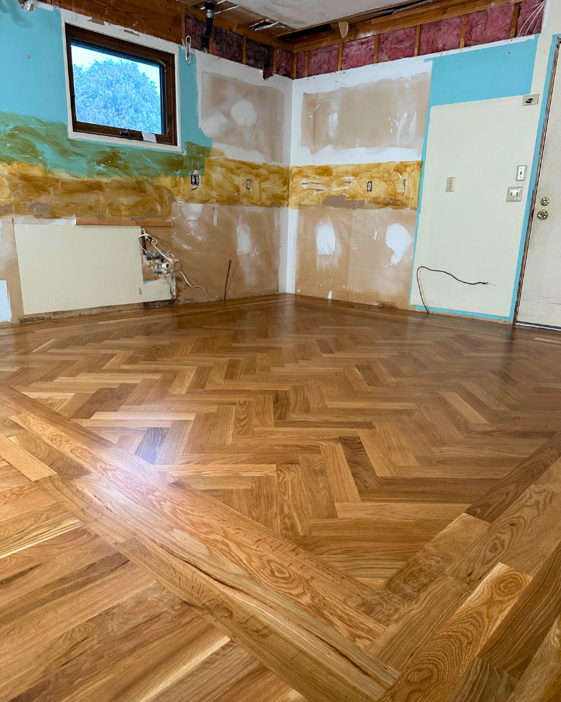 Natural white oak herringbone floors finished with Berger Seidle Green star located in St. Joseph Michigan. 